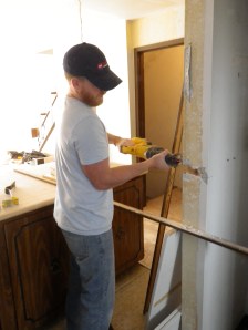 Tim begins to cut the pantry in half to make an island and a more open concept.